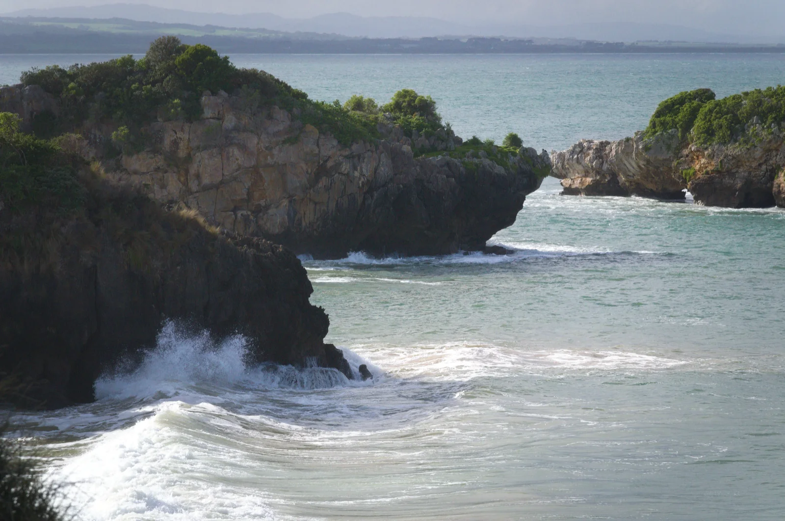 Rocks breaking the surf